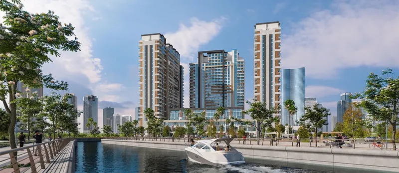 The District's towers above a landscaped canal edge with a boat passing (developer render)