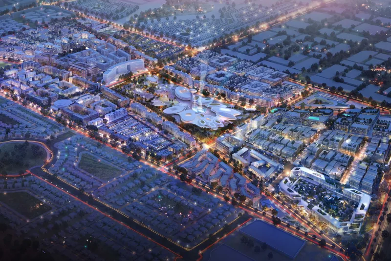Aerial dusk render of the Aljada master community in Sharjah with the Madar entertainment district at its centre