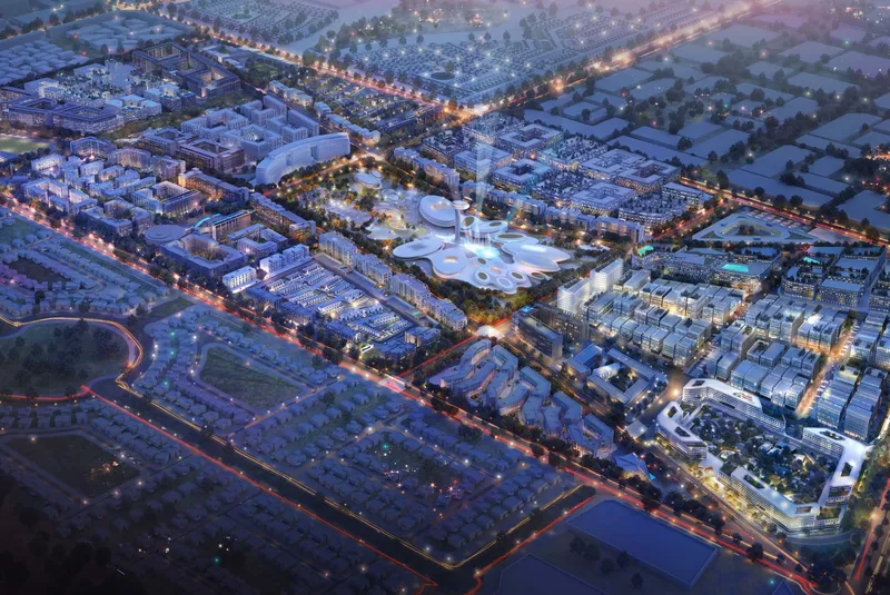 Aerial dusk render of the Aljada master community in Sharjah with the Madar entertainment district at its centre