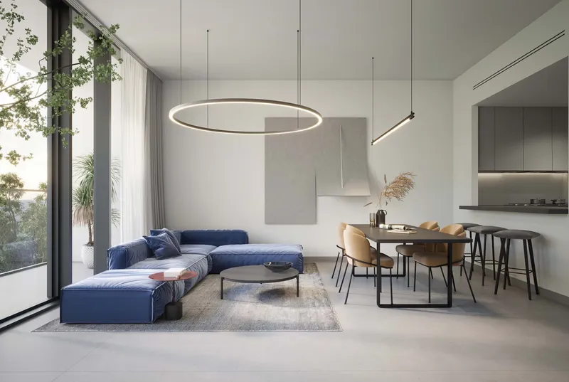 Render of an apartment living room at The Gate, Aljada, with a blue sofa, dining table, open kitchen and full-height windows