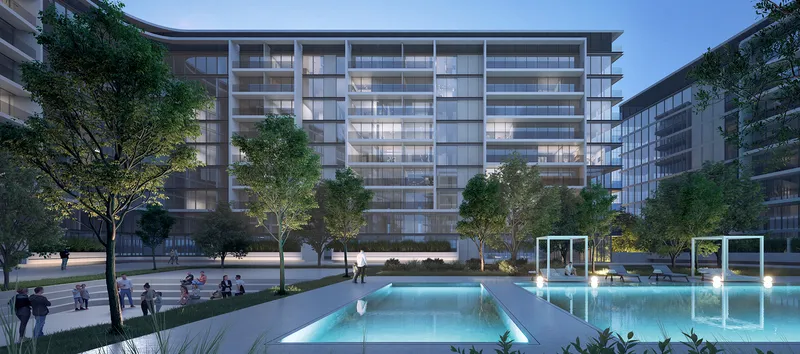 Dusk render of the swimming pool and landscaped courtyard between The Gate apartment buildings at Aljada, Sharjah