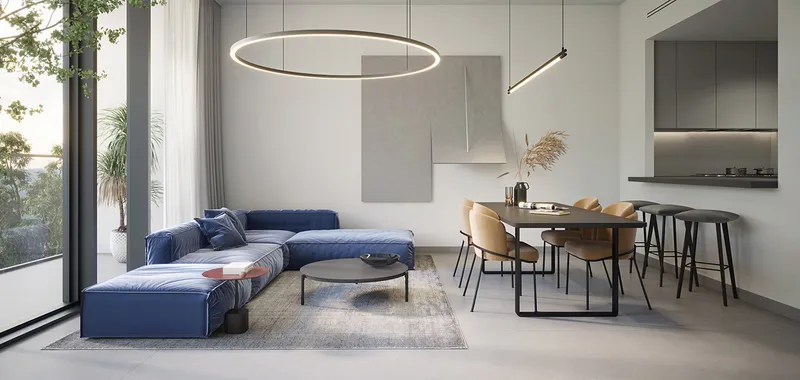 Render of an apartment living room at The Gate, Aljada, with a blue corner sofa, dining table, breakfast bar and full-height windows