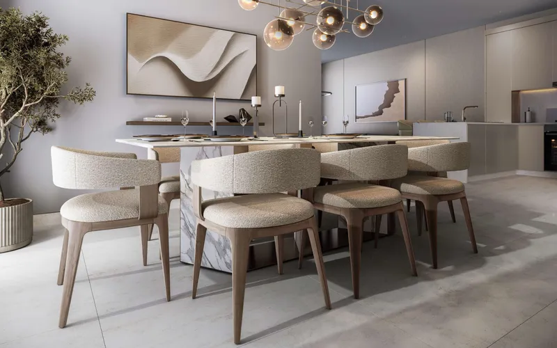 Render of a dining area and open kitchen in a villa at The Greens