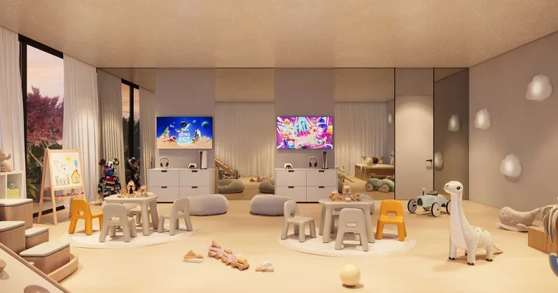 Children's playroom with small tables, toys and screens at The WOW Tower