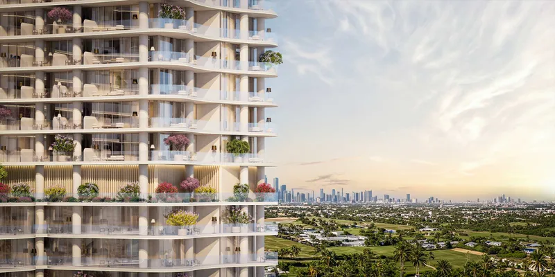Close view of the curved balconies and planters on The WOW Tower facade with open views to the skyline