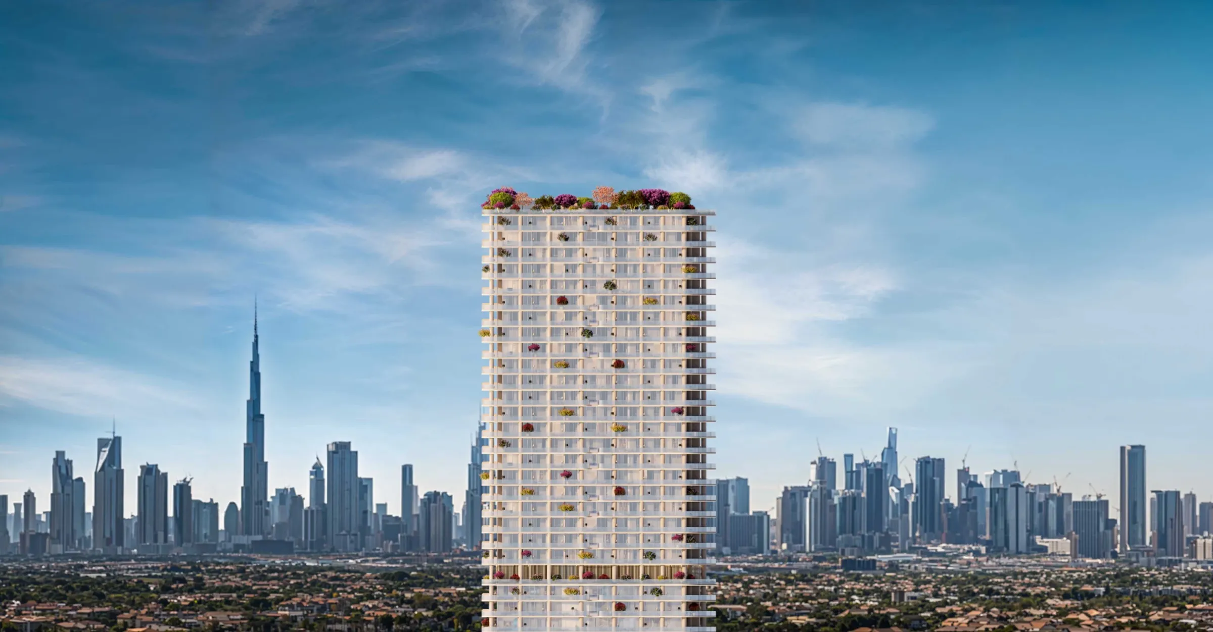 The WOW Tower with planted balconies and a rooftop garden, with the Downtown Dubai skyline behind
