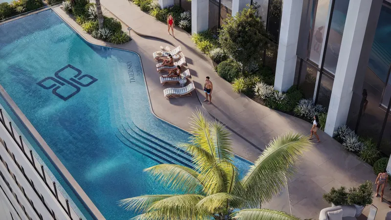 Aerial render of the outdoor swimming pool and loungers on the Tiger Sky Tower podium