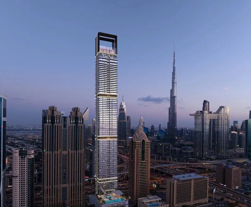 Trump International Hotel & Tower Dubai on Sheikh Zayed Road at dusk, with the Burj Khalifa behind