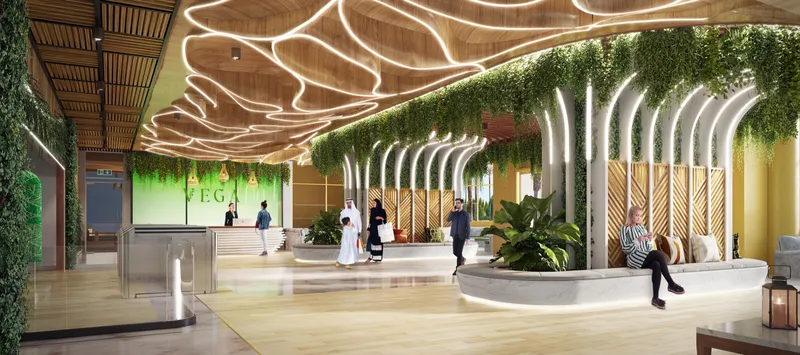 Lobby with a timber ceiling, hanging plants, a reception desk and curved seating