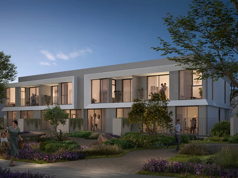 Render of Velora 2 townhouses at dusk with planted gardens in front