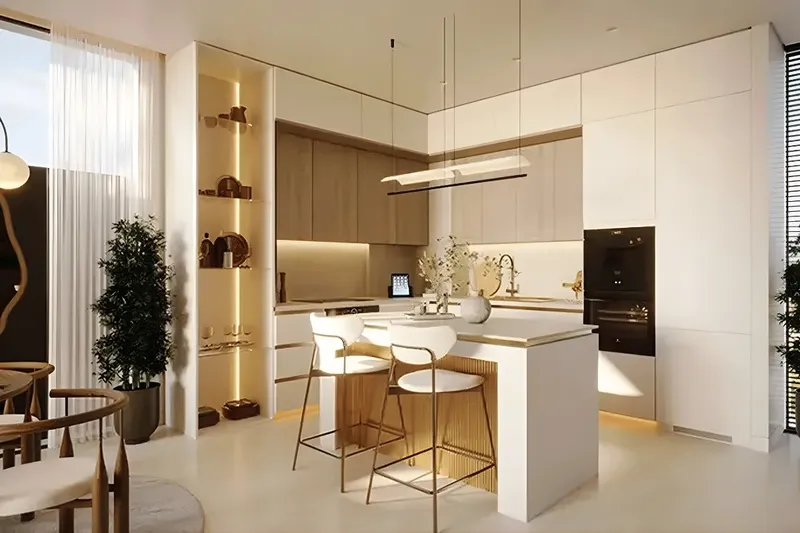 Open kitchen with an island and built-in appliances in a Veona by Gutti apartment
