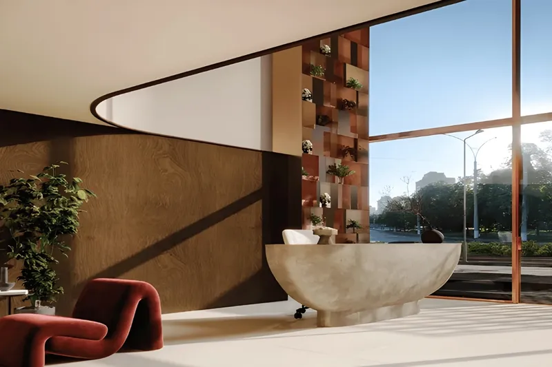 Lobby of Veona by Gutti with a stone reception desk and full-height glazing