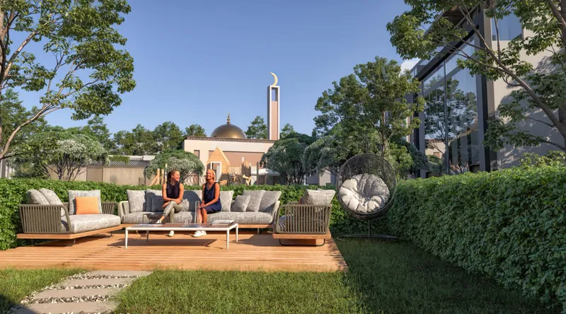 Landscaped garden with outdoor seating at Verdana VII, with the community mosque behind (developer render)