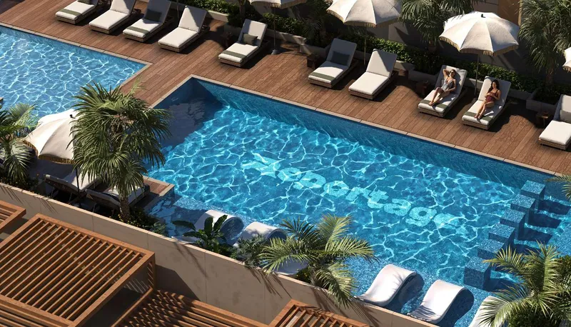 Swimming pool with timber deck and sun loungers at Verso, seen from above (developer render)