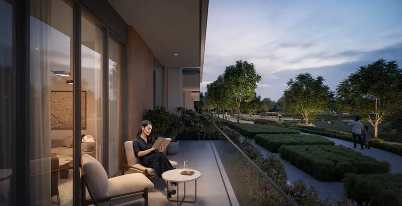 Render of a resident reading on a ground-level terrace facing the park at Vida Residences Hillside