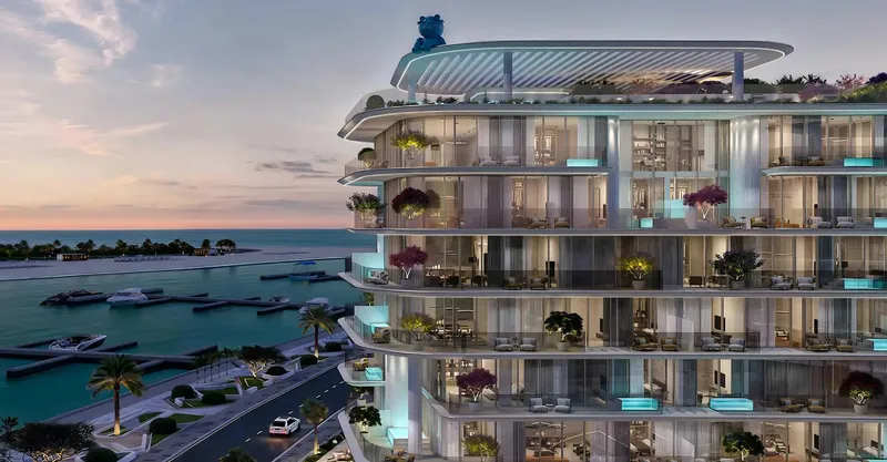 Curved balconies of Villa del Garda above a road, with the marina and the sea beyond