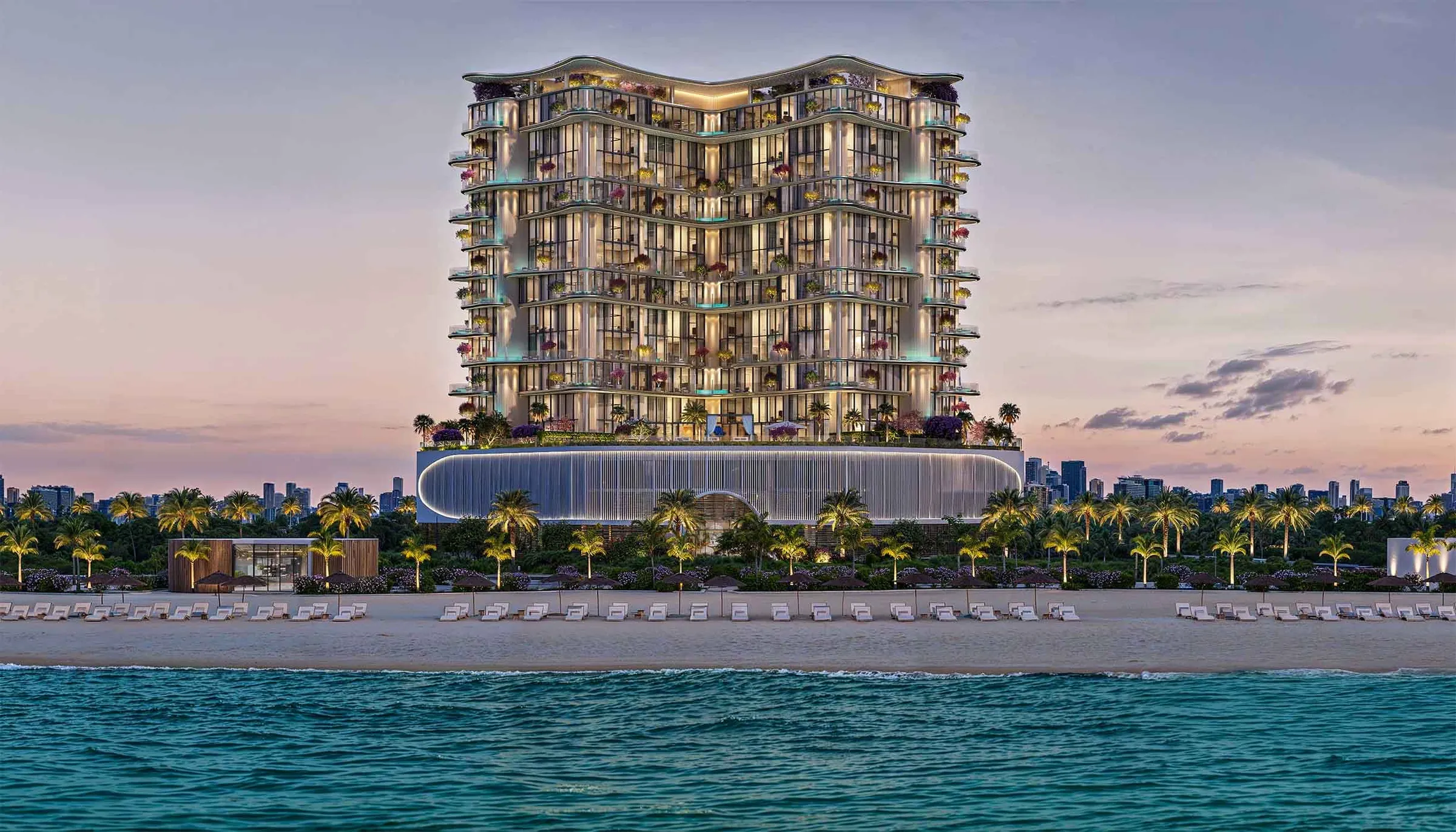 Villa del Gavi rising above a palm-lined beach on Dubai Islands at dusk, seen from the sea