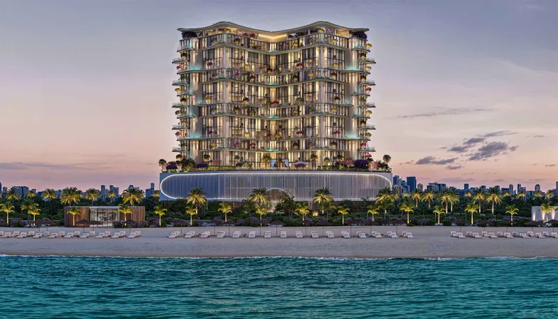 Villa del Gavi rising above a palm-lined beach on Dubai Islands at dusk, seen from the sea
