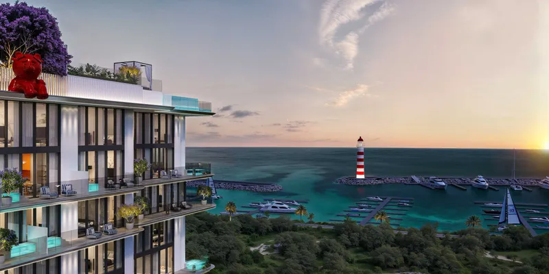 Balconies of Villa dell'Arte overlooking the marina and lighthouse of Dubai Islands
