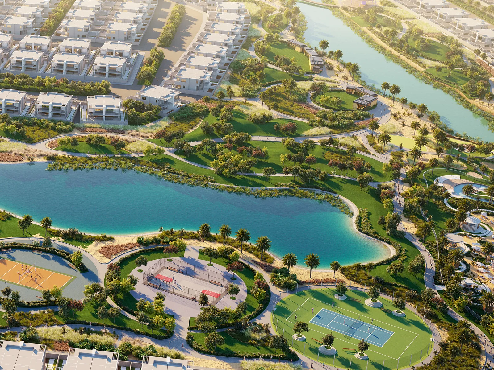 Aerial view of townhouse rows around a lake, tennis courts and a sports court in DAMAC Hills 2