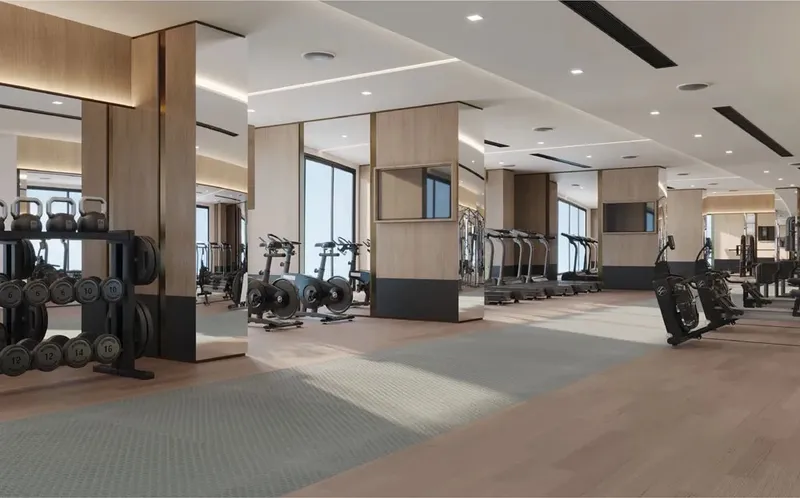 Interior render of the Volga Tower gym with free weights and cardio machines