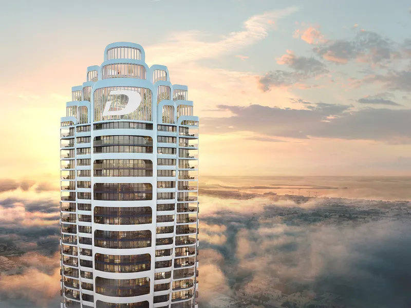 The crown of the Volta tower above the clouds at sunset