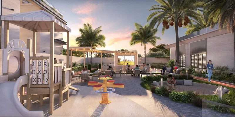 Evening render of the zen garden at Wellington Grand Villas with a children's play structure, seating and an outdoor screen