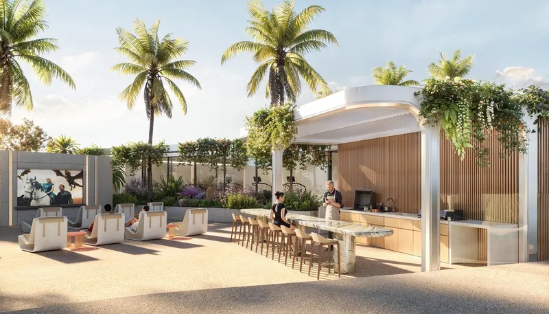 Render of the outdoor cinema seating and covered barbecue counter among palm trees at Weybridge Gardens 4