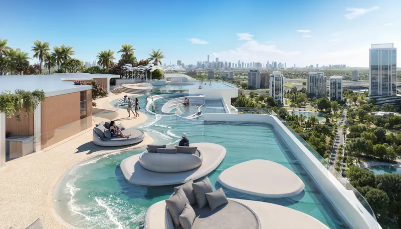 Render of the rooftop pool at Weybridge Gardens 4 with sunken loungers, round daybeds and a sandy beach edge