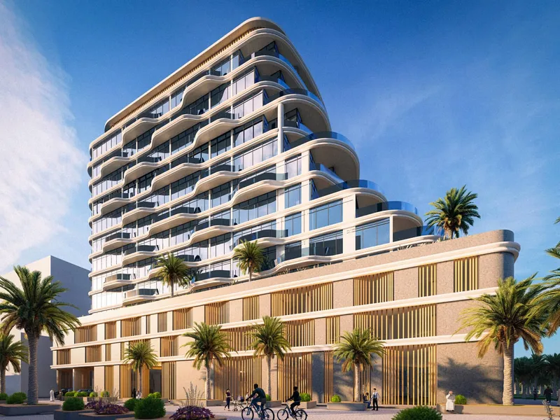 Daytime view of Zephyra Residences with curved white balconies and a slatted podium