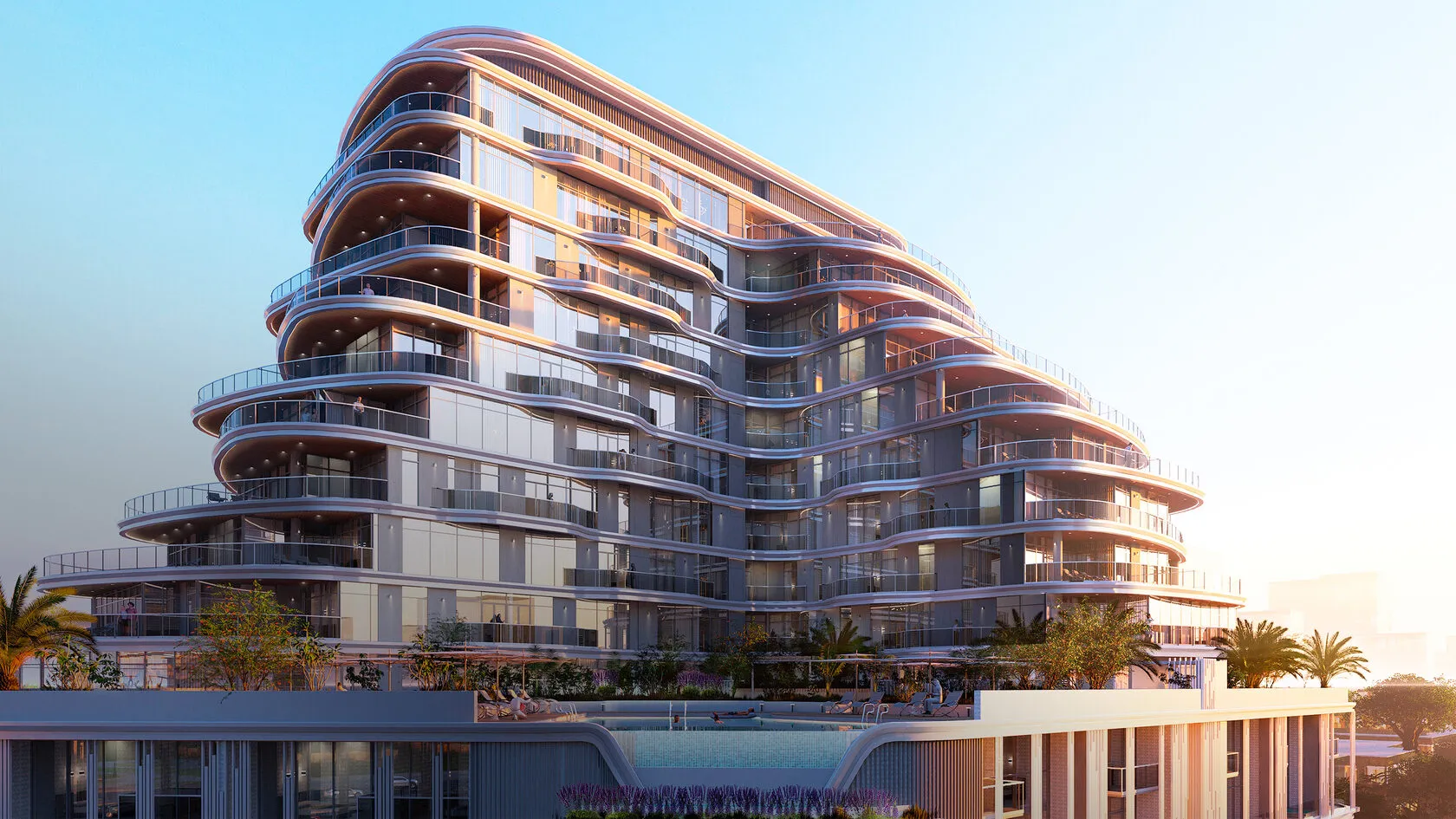 Zephyra Residences at dusk, a building with curved stepped terraces above a pool deck