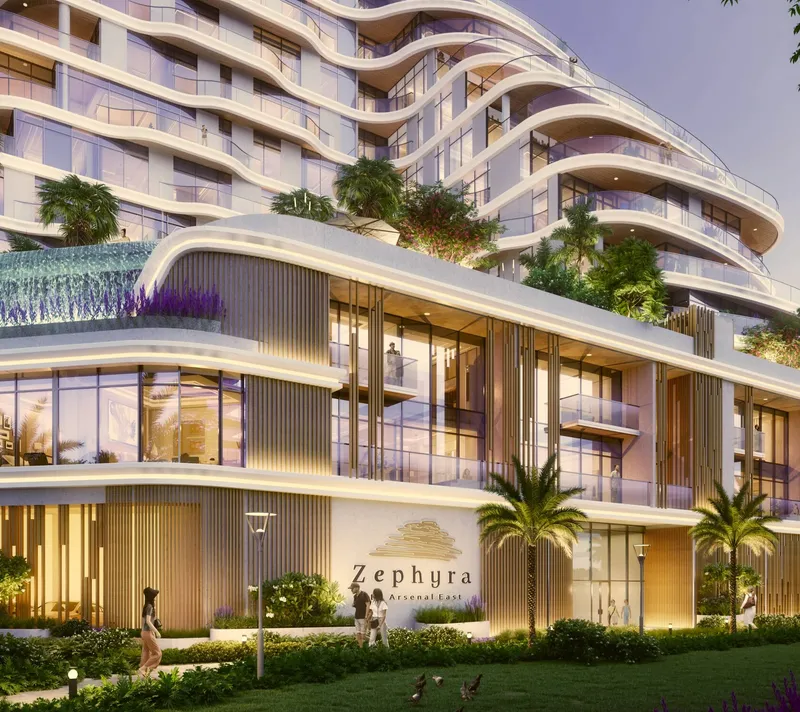 Street-level view of the Zephyra Residences entrance and podium with planted terraces above